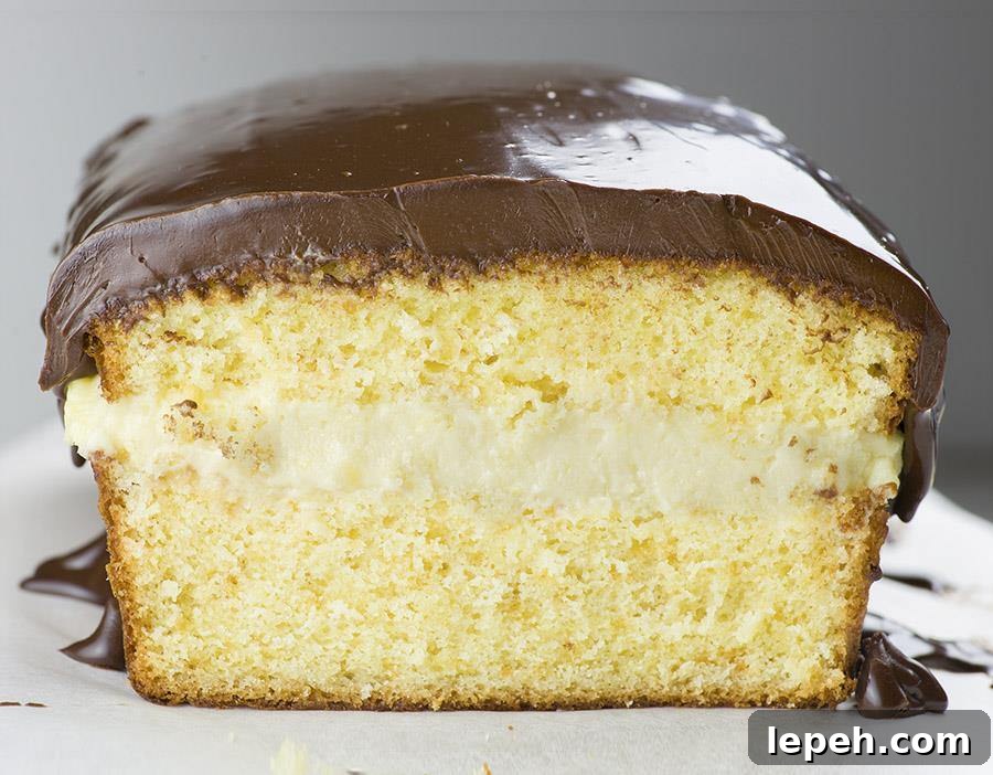 Boston Cream Pie Pound Cake - magnificent, smooth and creamy filling with vanilla flavor sandwiched between two cake layer, topped with rich chocolate ganache! Winning combo!