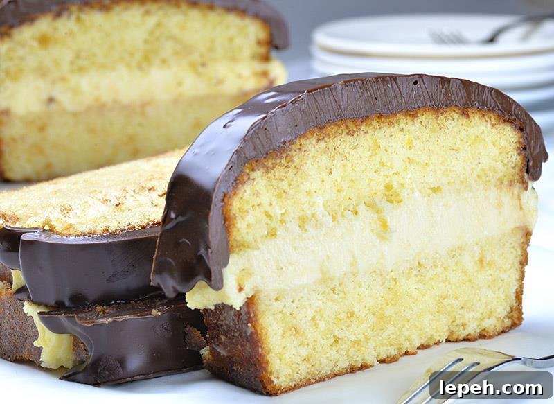 Boston Cream Pie Pound Cake - magnificent, smooth and creamy filling with vanilla flavor sandwiched between two cake layer, topped with rich chocolate ganache! Winning combo!