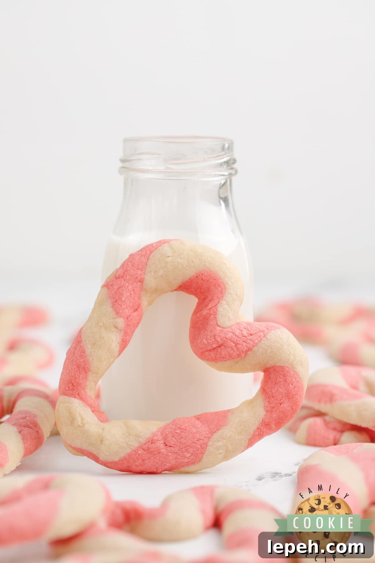 Braided Sweetheart Cookies are simple sugar cookies formed into pink and white striped hearts. These heart-shaped cookies are easy to make and are so pretty, you don't even need frosting!