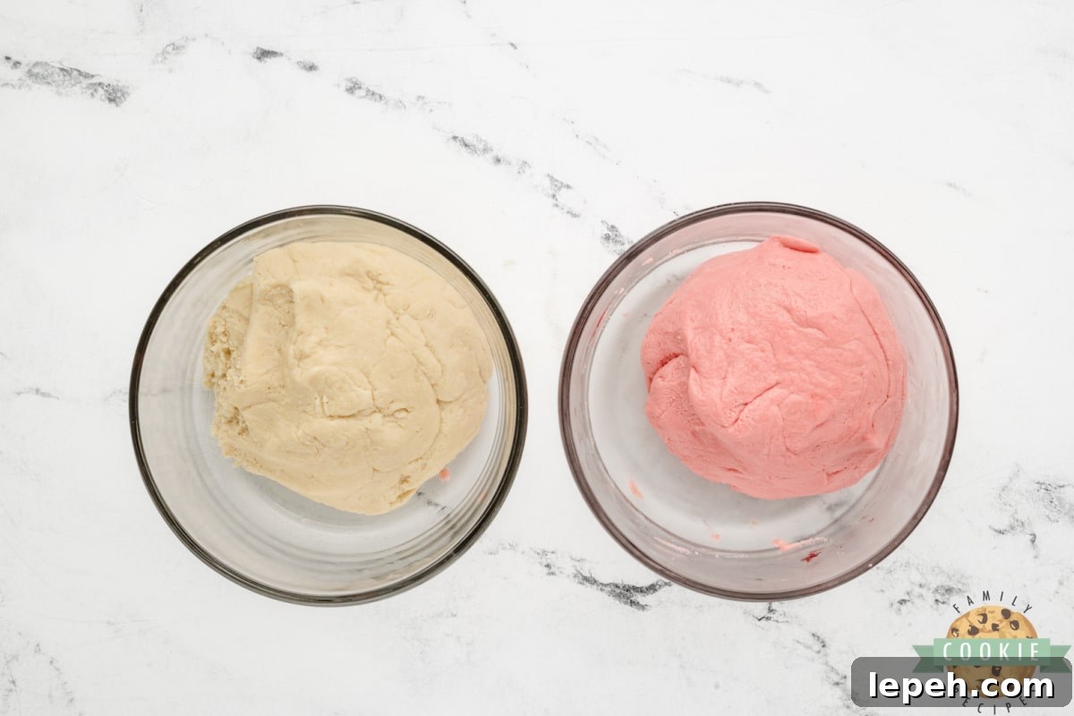 Dough divided in half, with half dyed pink.