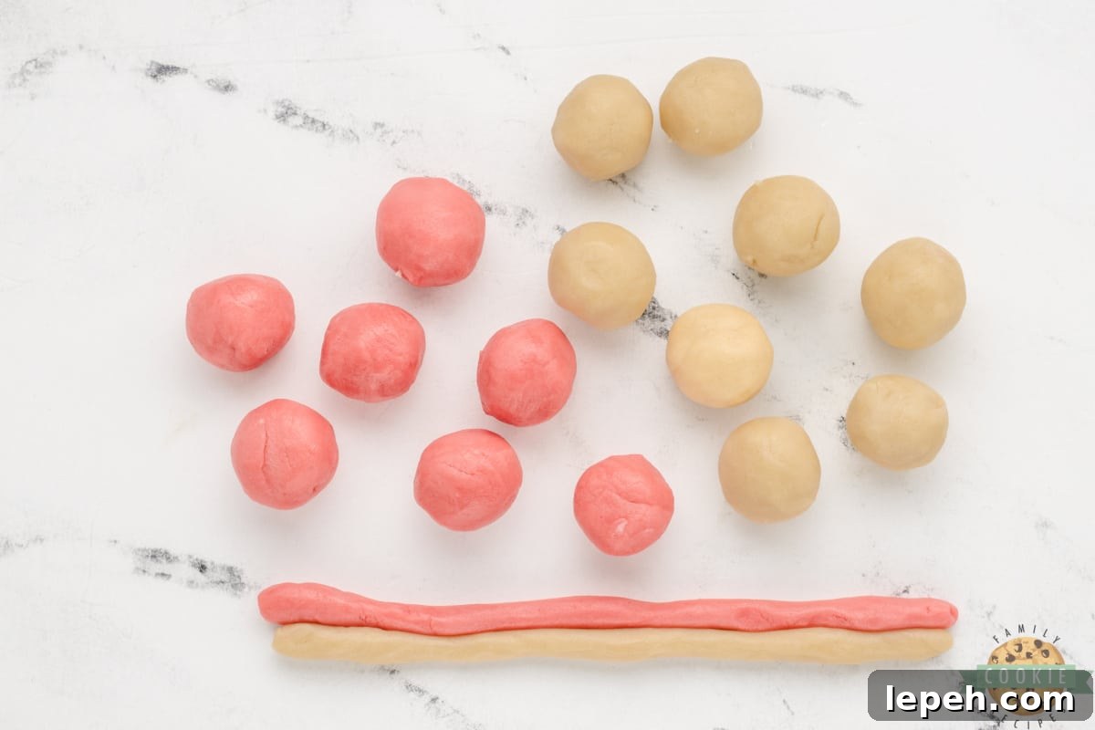 Balls of dough shaped into ropes.