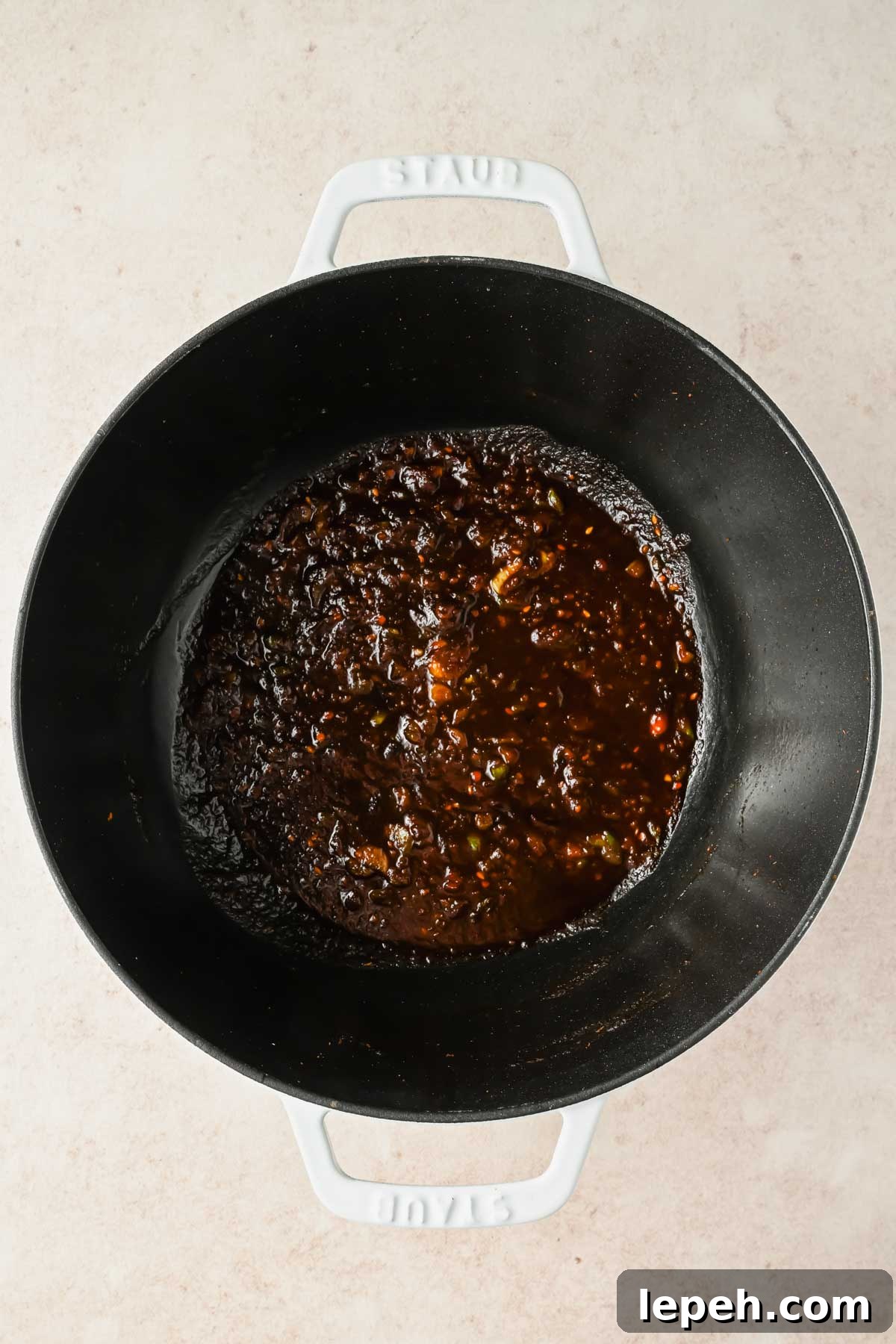 curry sauce in large black pot.