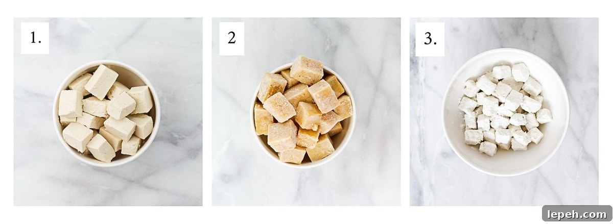 Picture of three bowls of tofu, one cut up, one frozen, and one coated in cornstarch.