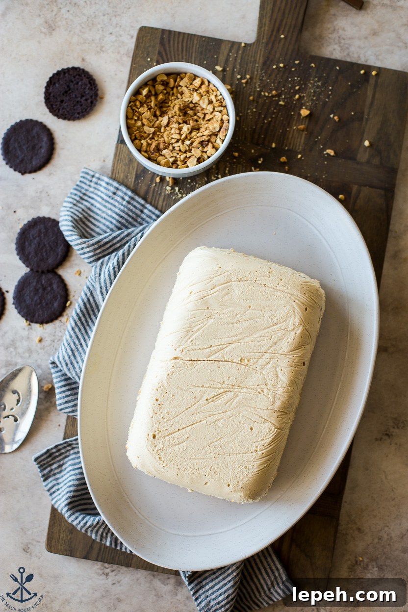 Overhead photo of a pre-glazed peanut butter ice box cake on an oval plate