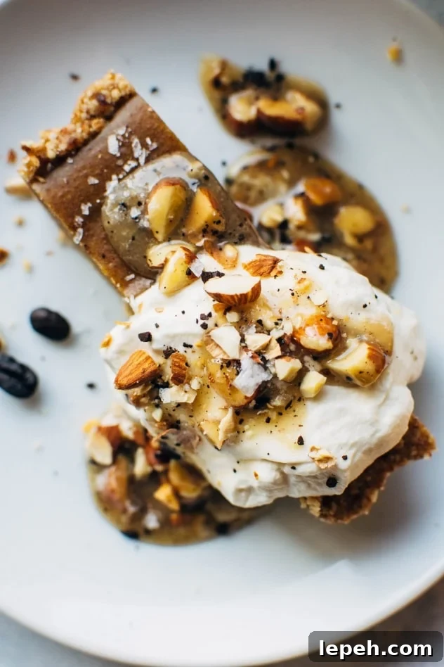 No bake pumpkin tart with salted coffee caramel that is paleo and dairy free! SO easy to make and packed full of fall flavors, this dessert is sure to please everyone at your table!