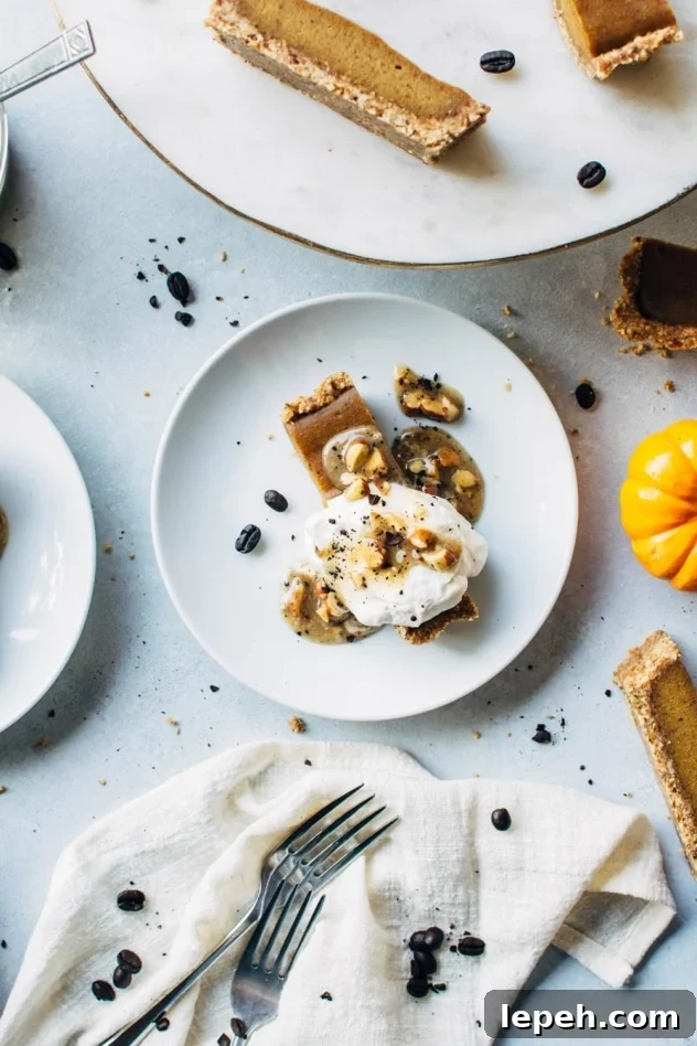 No bake pumpkin tart with salted coffee caramel that is paleo and dairy free! SO easy to make and packed full of fall flavors, this dessert is sure to please everyone at your table!