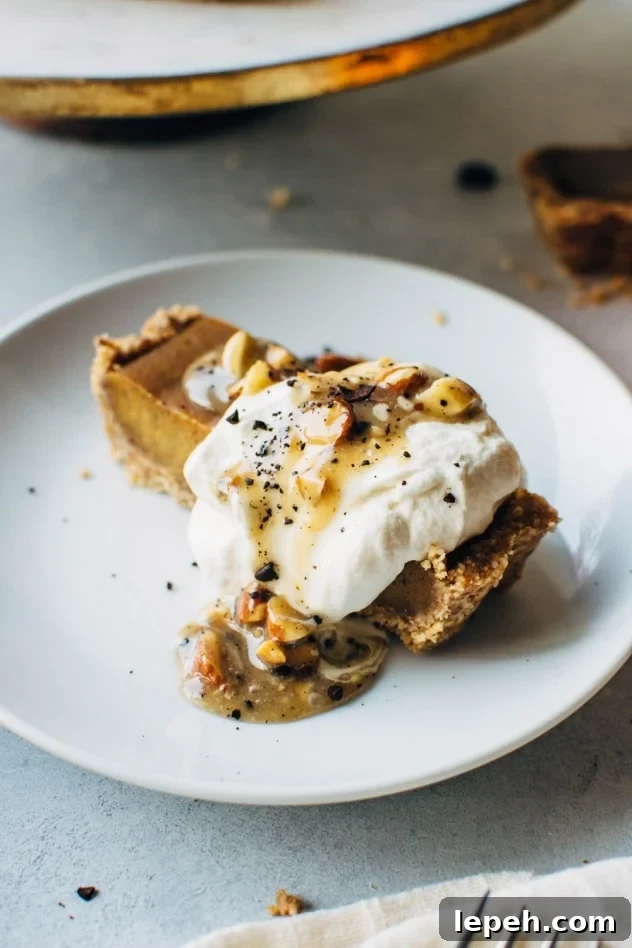 No bake pumpkin tart with salted coffee caramel that is paleo and dairy free! SO easy to make and packed full of fall flavors, this dessert is sure to please everyone at your table!