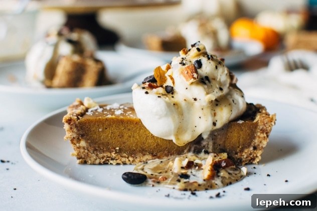 No bake pumpkin tart with salted coffee caramel that is paleo and dairy free! SO easy to make and packed full of fall flavors, this dessert is sure to please everyone at your table!