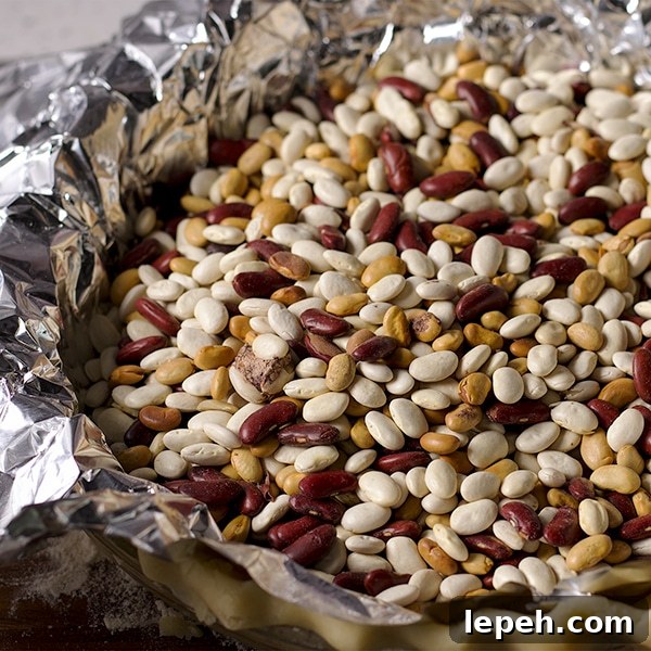 Weighting down pie dough with dried beans before baking it.