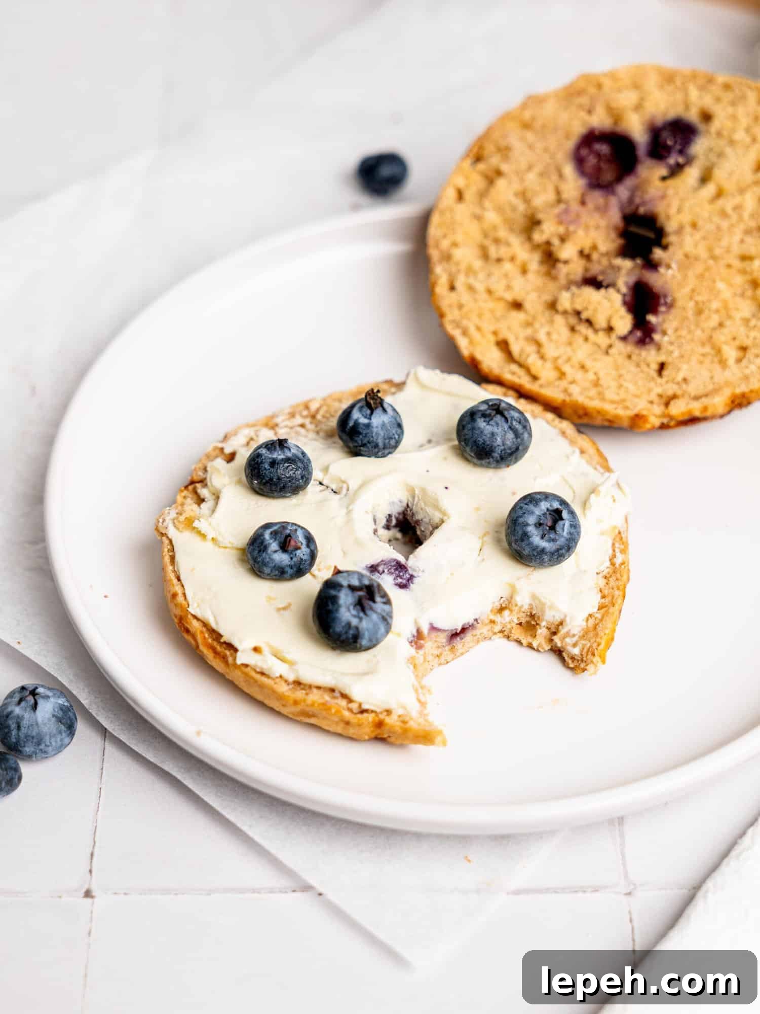 Blueberry bagel with cream cheese.
