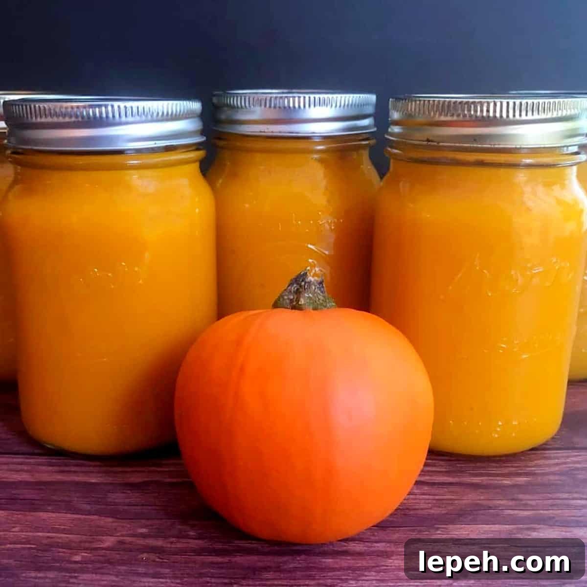 three jars of pumpkin puree made in the instant pot