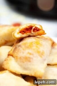 A close-up of a pile of air fryer pizza rolls.