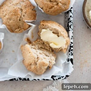 Sourdough Discard Banana Muffins on white parchment paper.