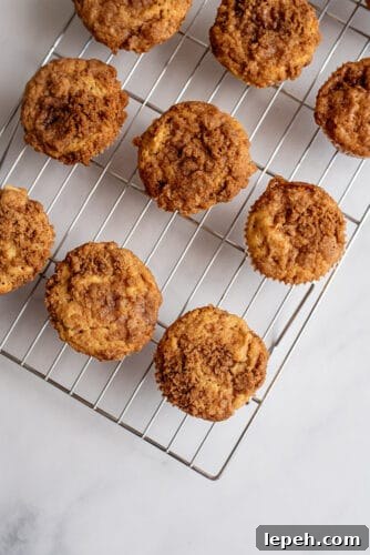 Apple pie muffins on cooling tray.
