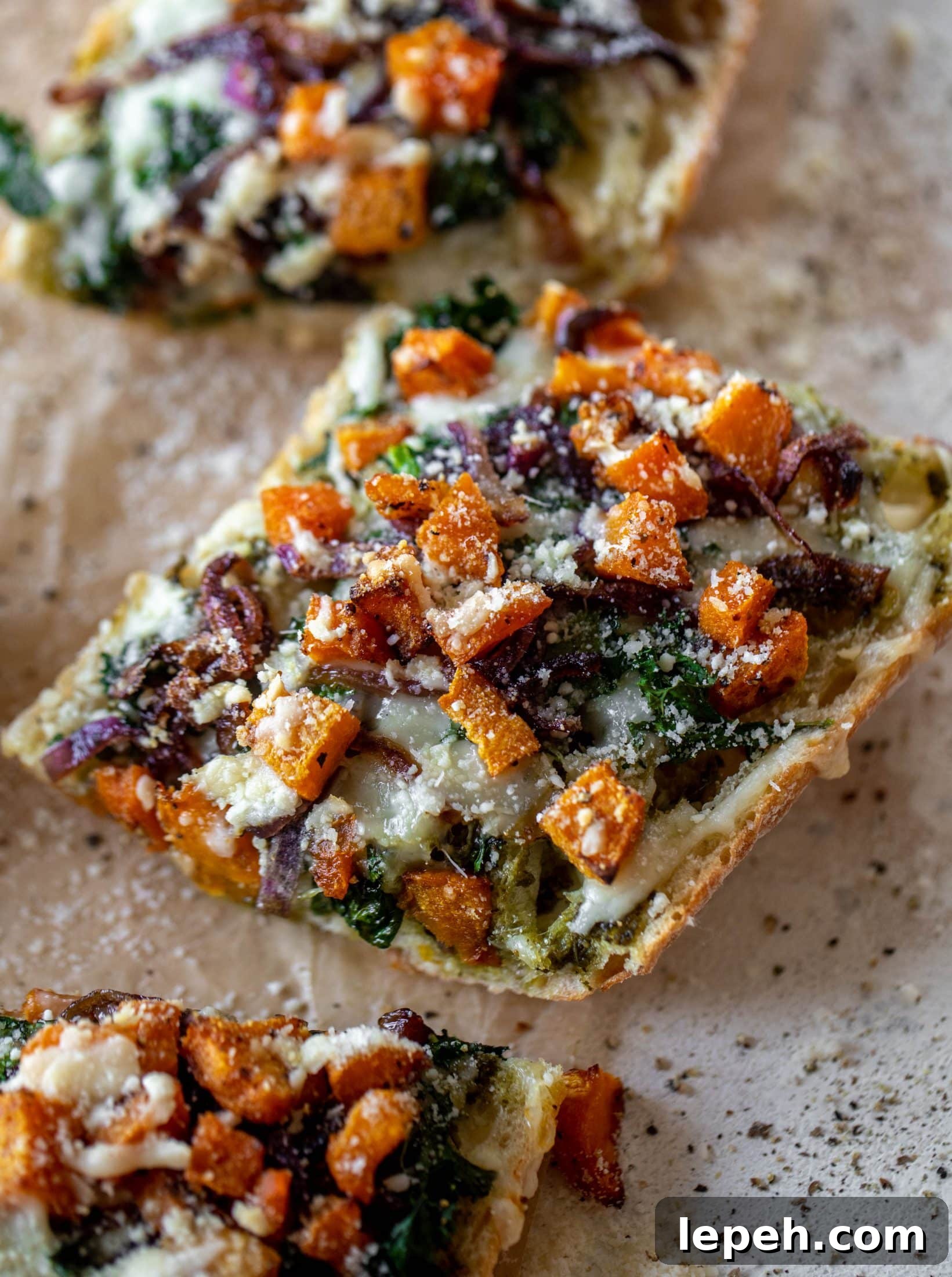 These butternut squash french breads have so much flavor. Pesto, caramelized onions, kale, roasted butternut and tons of fontina cheese. Delicious!