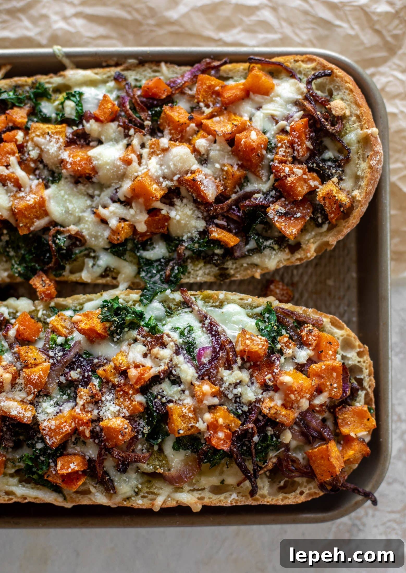 These butternut squash french breads have so much flavor. Pesto, caramelized onions, kale, roasted butternut and tons of fontina cheese. Delicious!