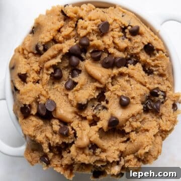 High-protein edible cookie dough made with whey protein and cottage cheese topped with mini chocolate chips.