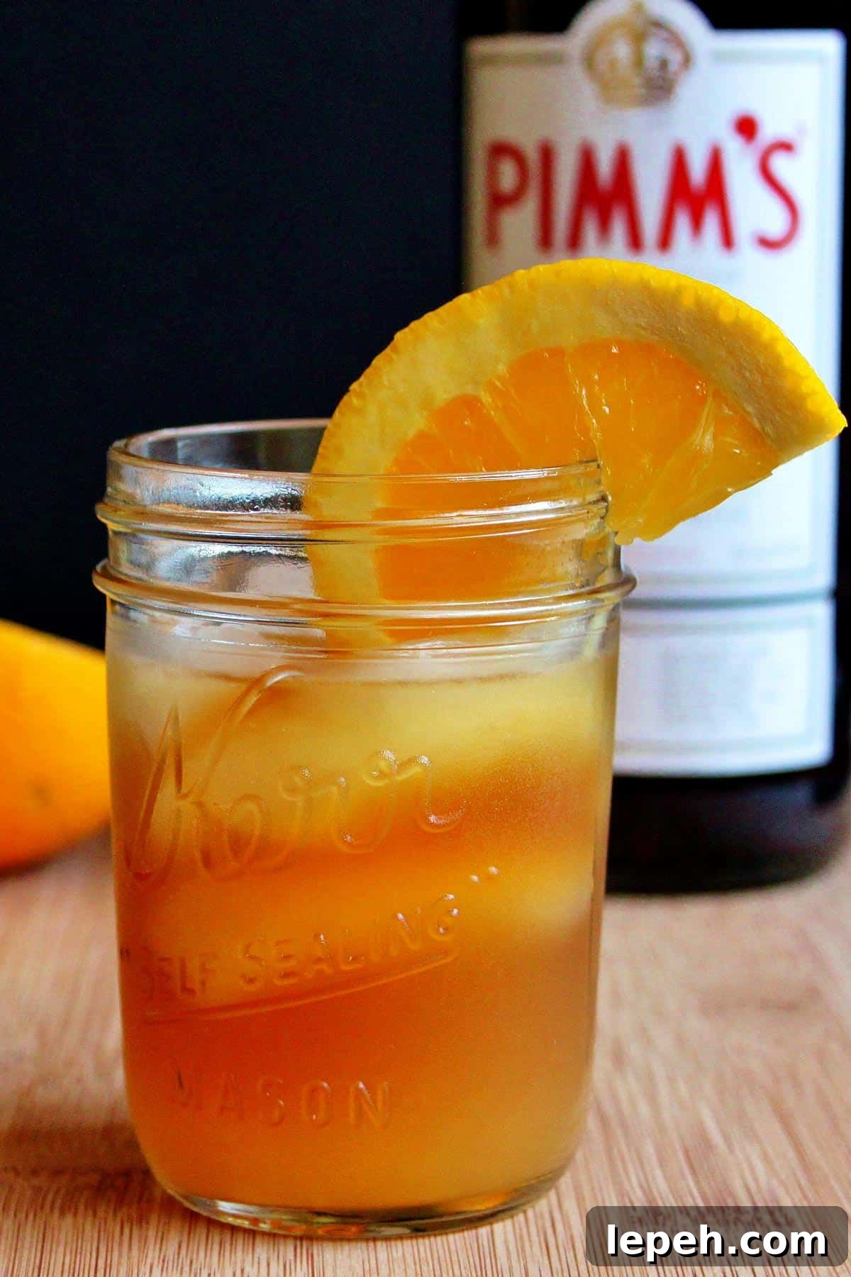 A glass of Pimm's sundowner on a cutting board.