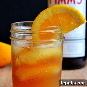 A glass of Pimm's sundowner on a cutting board.