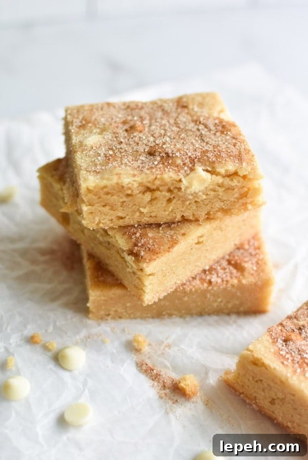 Stacked snickerdoodle blondies with cinnamon sugar on top