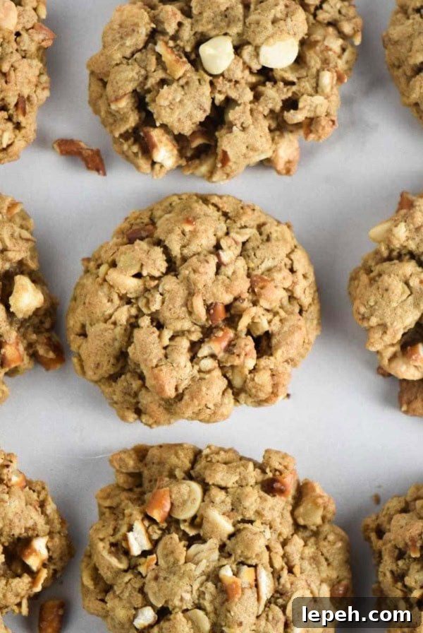 Nine white chocolate cookies on a white table