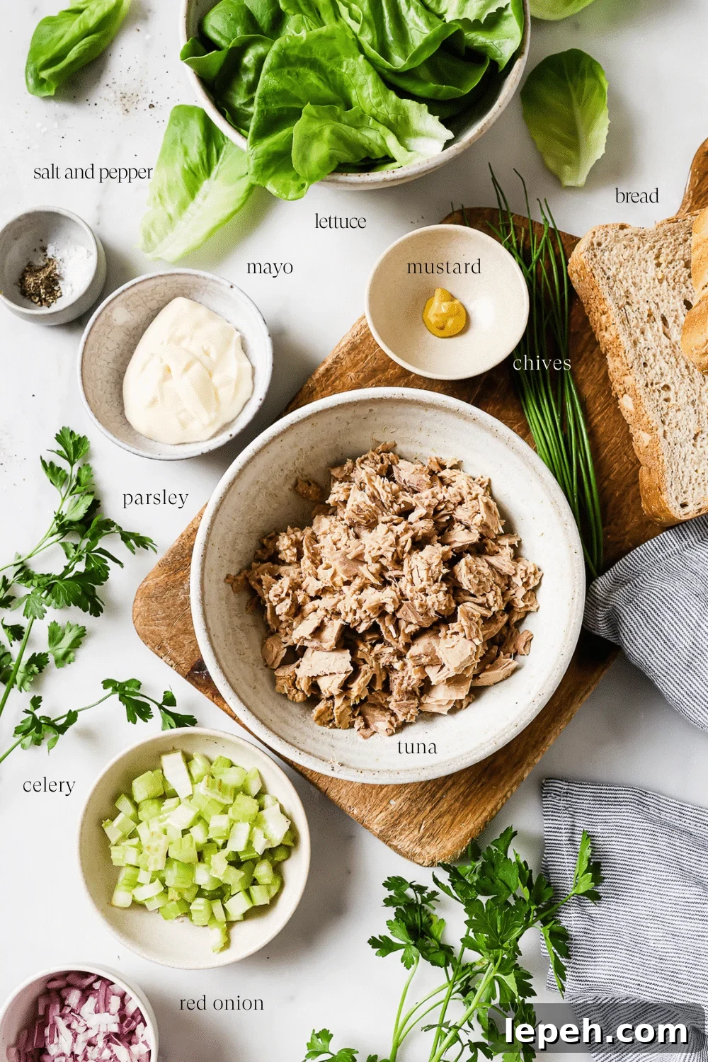 Small bowls of pre-measured ingredients on a white countertop.