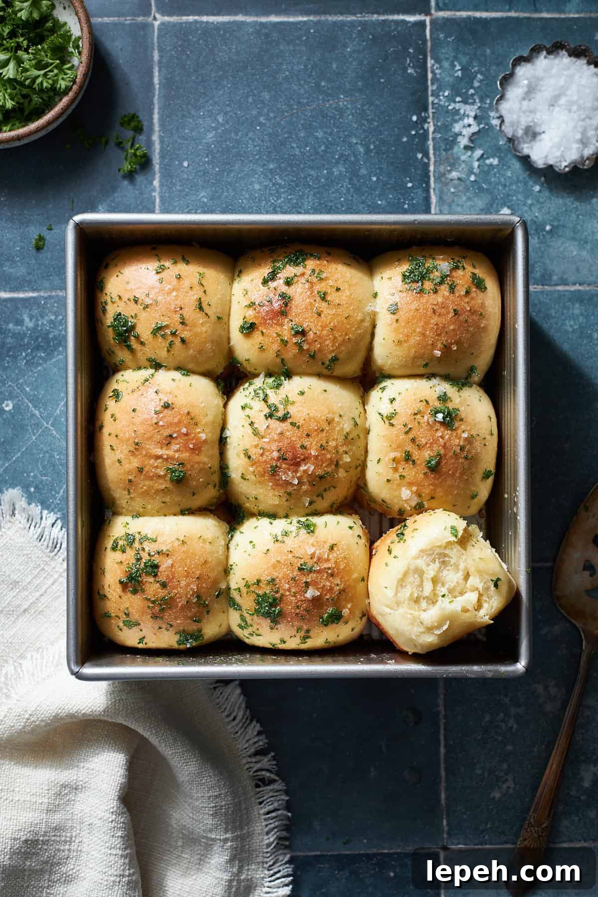 Sourdough Discard Garlic Rolls in a square baking pan. 