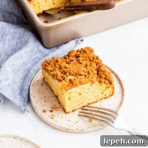Apple crumb cake served on a dessert plate.
