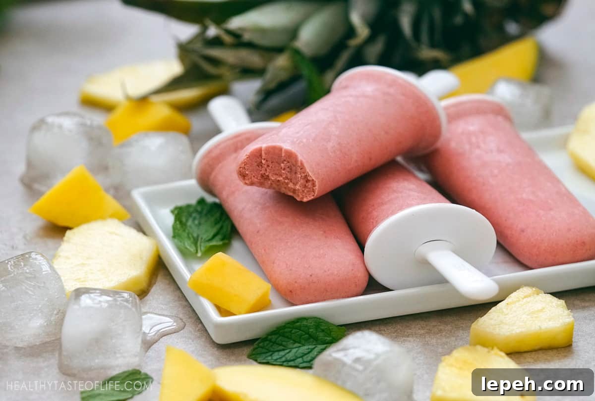 Tropical popsicles - sugar free, dairy free made with whole fruits like mango, pineapple, banana and strawberry.