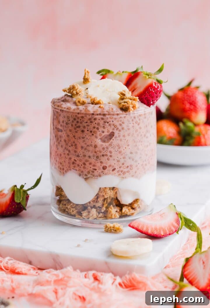 one glass jar containing strawberry banana chia pudding