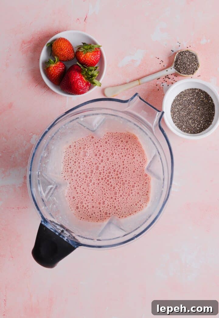 Strawberry banana protein milk in a blender