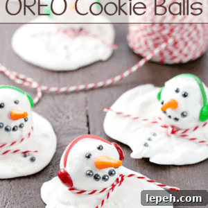 Melting Snowman OREO Cookie Balls laying on a cutting board.