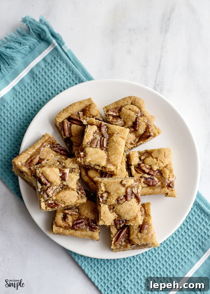 Salted Caramel Pecan Bars on white plate
