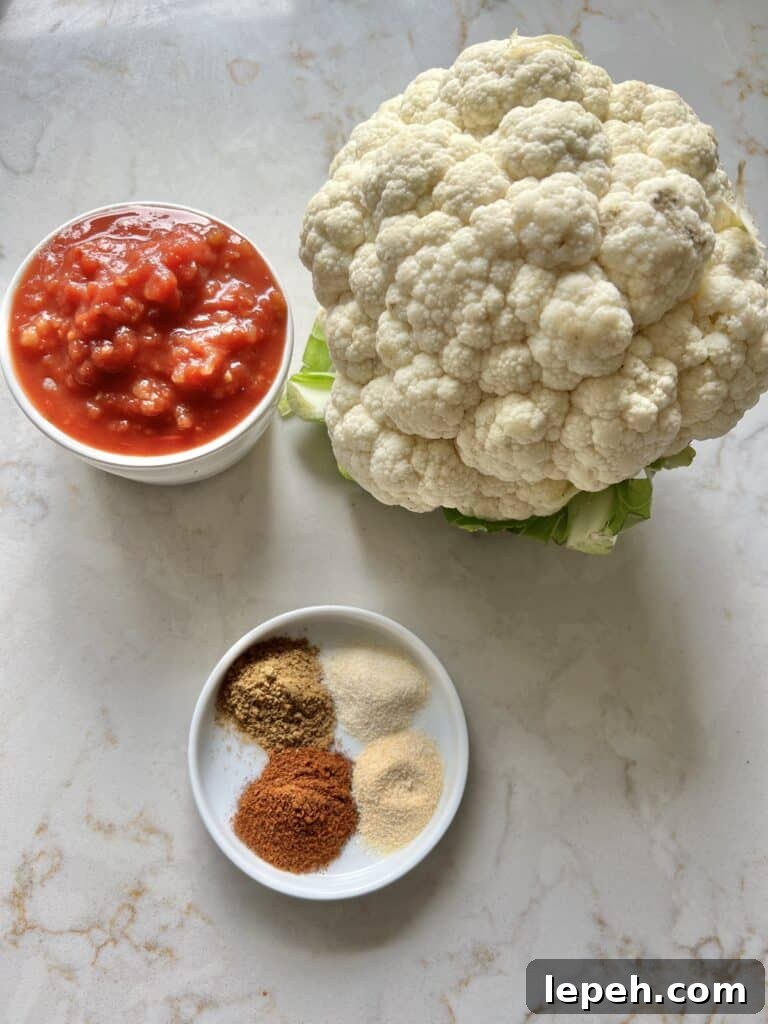 ingreidnets for spanish cauliflower rice against white marble backgrou d
