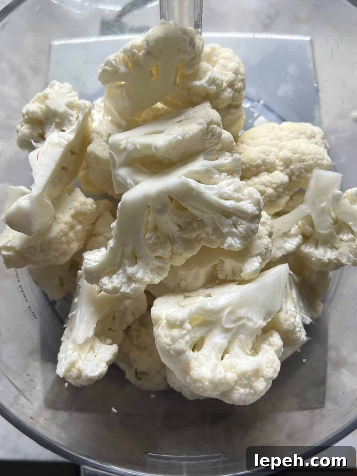 sliced cauliflower against a white background