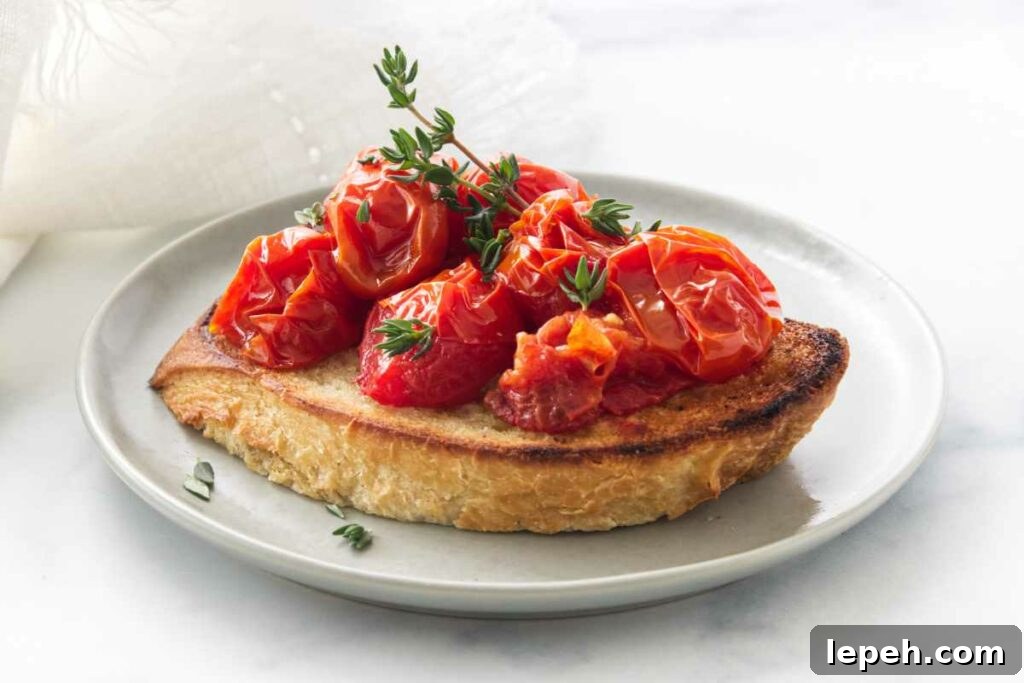 A small appetizer plate with conti tomato bruschetta garnished with fresh thyme sprigs.