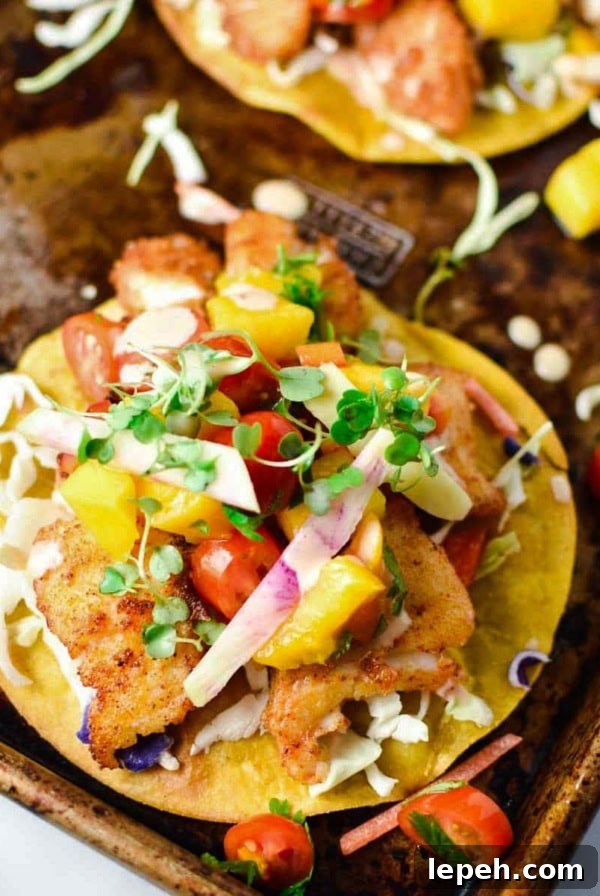 A fish tostada on a baking sheet.