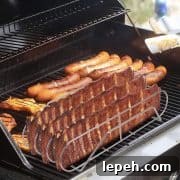 Rib rack on grill with ribs and sausages