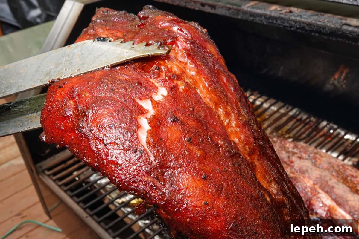 Ribs being bent to show they are finished cooking