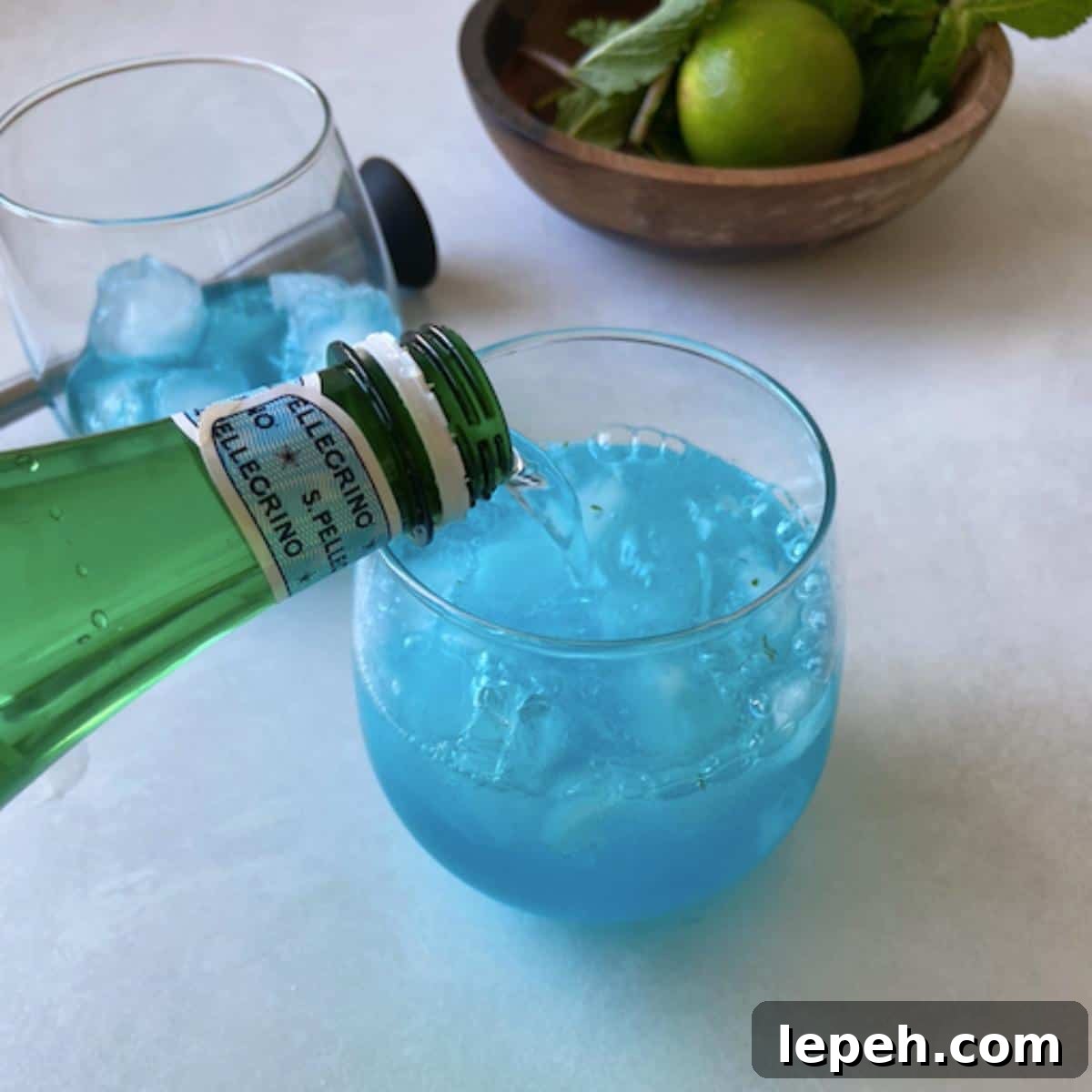 Topping mojito with mineral water.