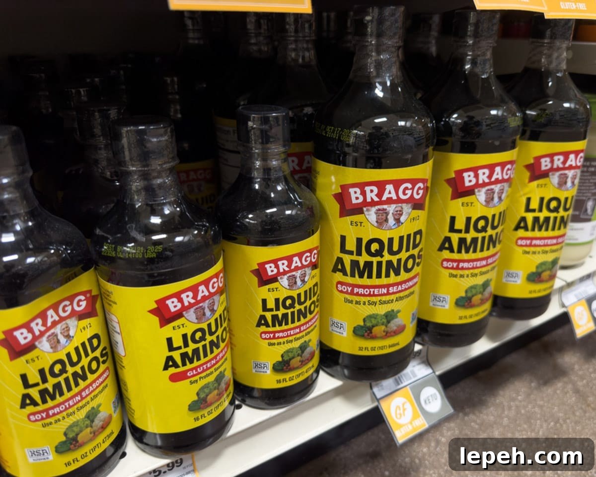 Bottles of liquid aminos on the shelf at the grocery store.