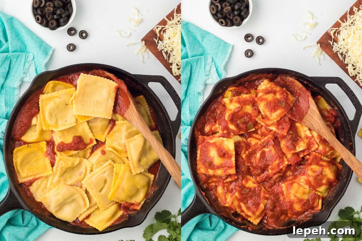 Cooked ravioli added to prepared red sauce in a skillet and mixed together.