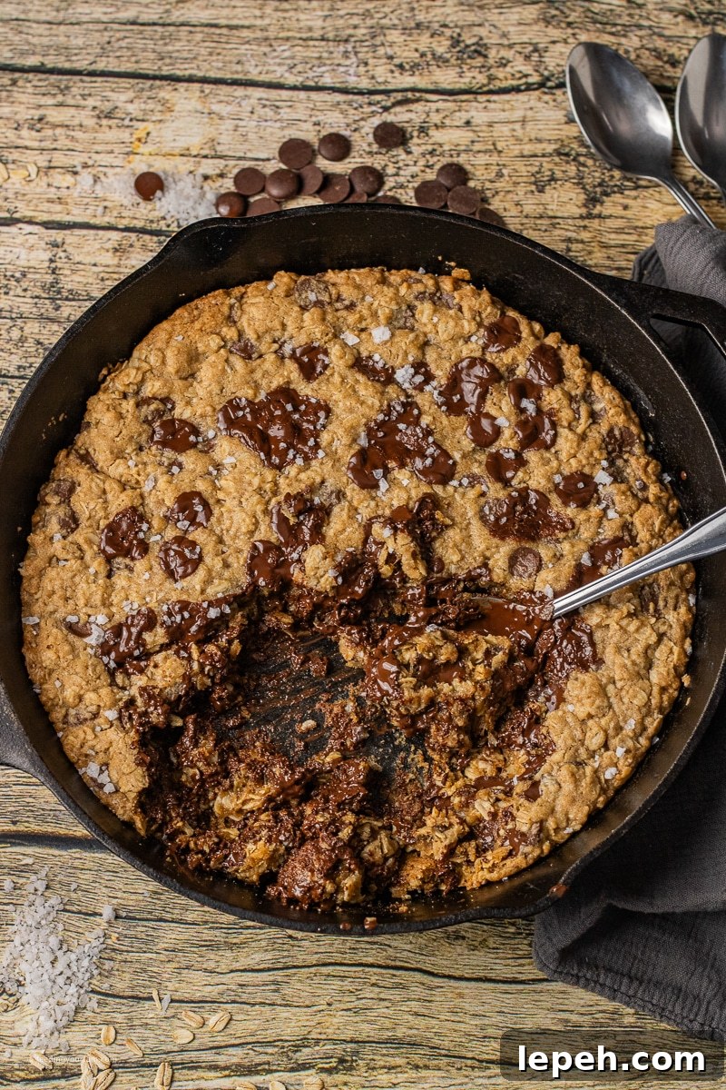 Oatmeal chocolate chip cookie in a cast iron skillet
