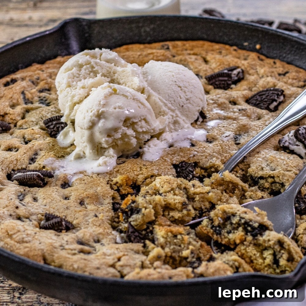 cookies and cream skillet cookie topped with ice cream