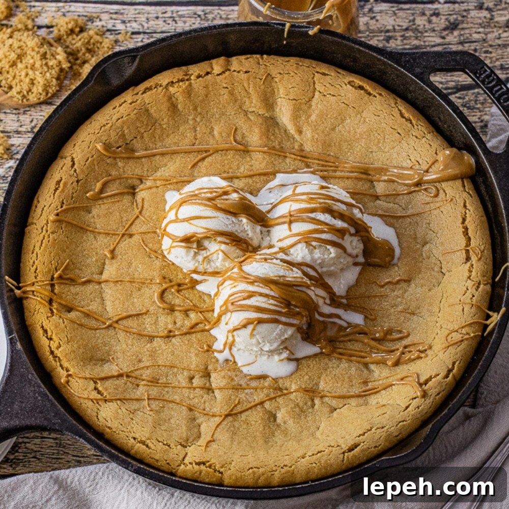peanut butter skillet cookie topped with vanilla ice cream