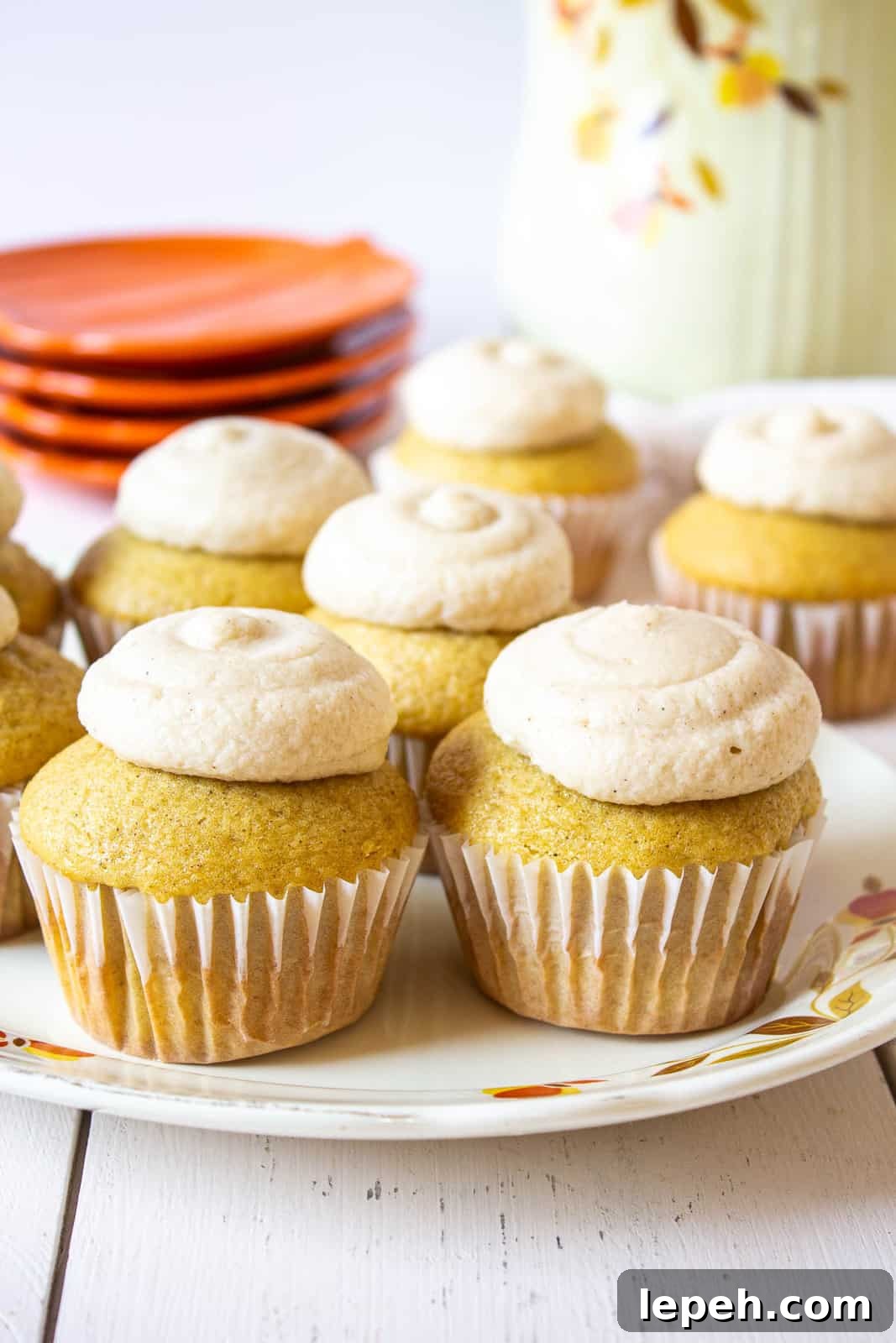Cupcakes topped with frosting on a plate.