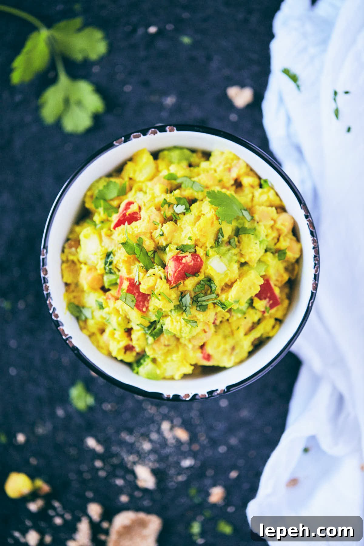 Curry chickpea salad in a bowl ready to be stuffed into pitas