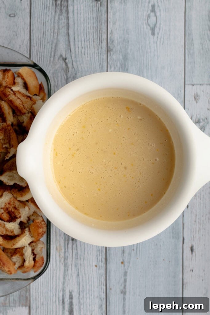 custard mixed up before being poured over cinnamon rolls