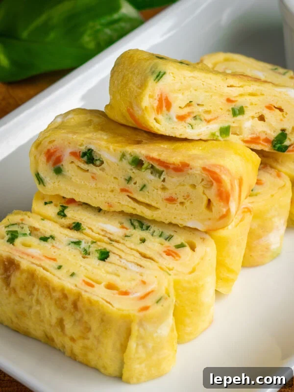 gyeran mari (Korean rolled omelette) with green onions and shredded carrots.