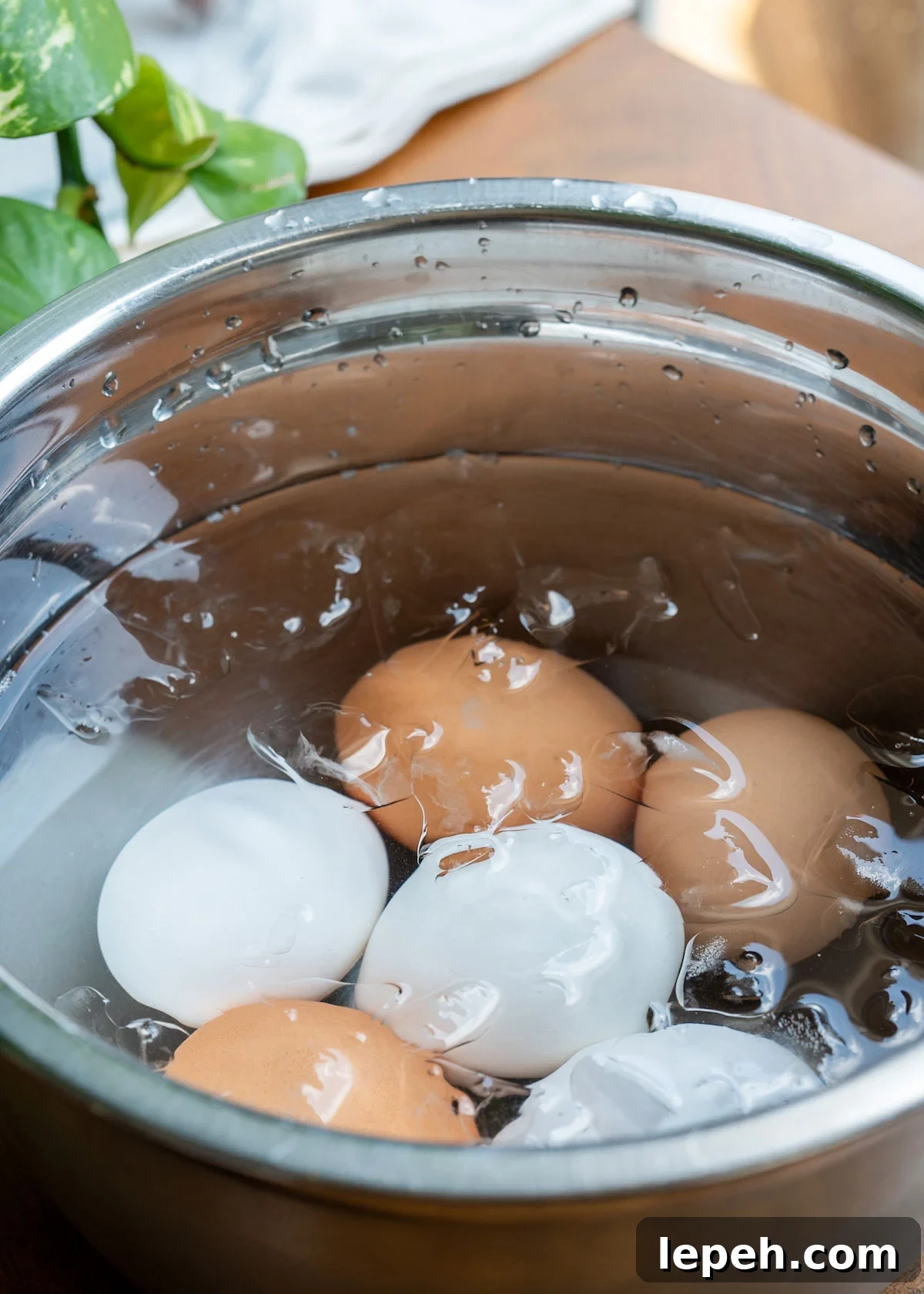 boiled eggs placed into an ice bath
